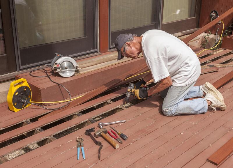man repairing the deck